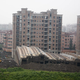 Illustration for article titled Entire New 13-Story Building Tips Over in Shanghai